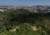 FILE PHOTO: A drone view shows the city and an area under permanent protection that was illegally deforested, in Maua