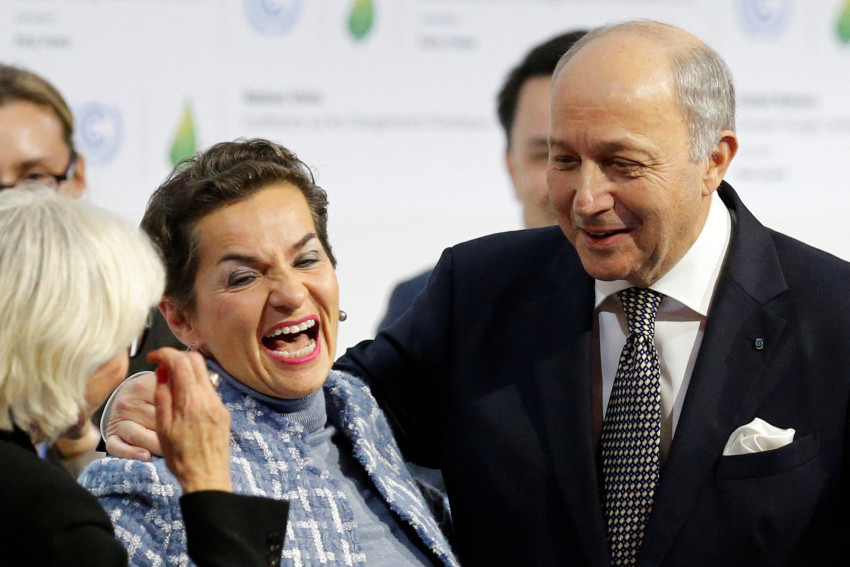 FILE PHOTO: French Foreign Affairs Minister Laurent Fabius, President-designate of COP21, and Christiana Figueres react at the World Climate Change Conference 2015 (COP21) at Le Bourget