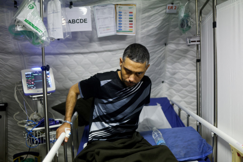 Palestinian former nurse sits at a UAE makeshift hospital on a ship in Al Arish